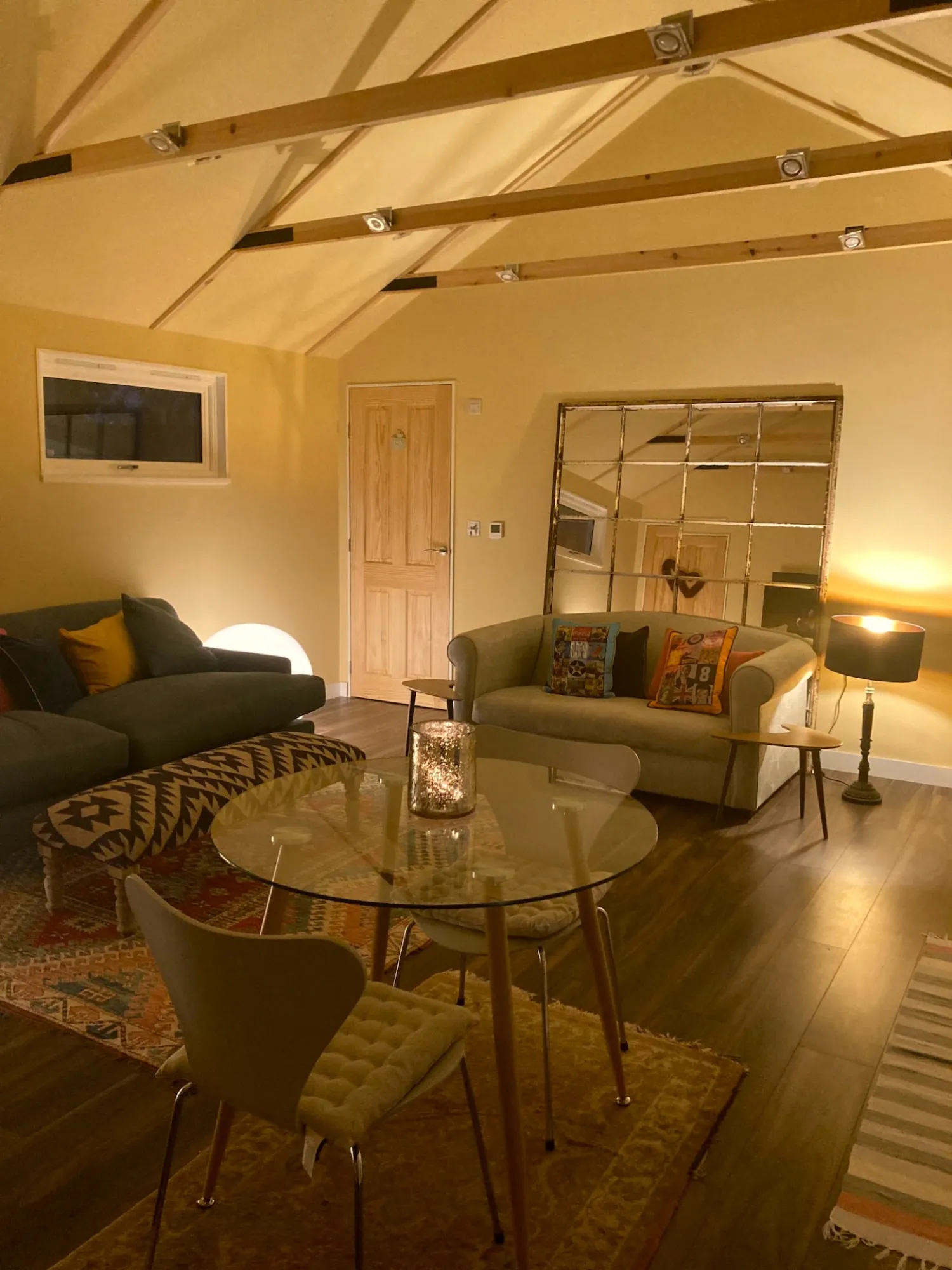 The living room of the dacha with its exposed beams